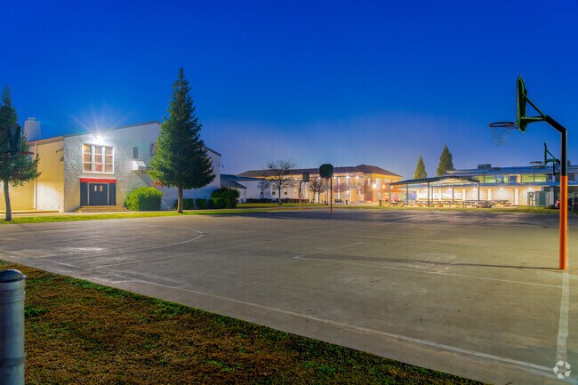Lights shine on basketball court at Marysville High School.