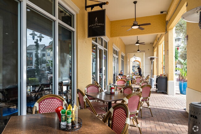 The Pub & Grill at Ave Maria in Immokalee features outdoor dining with views of the village.