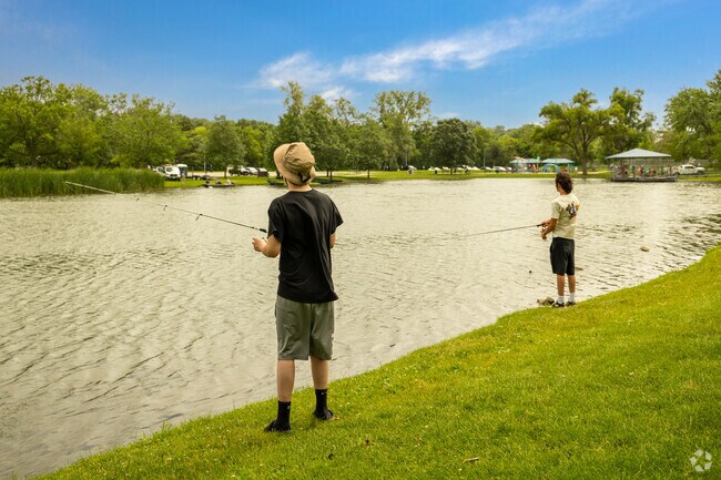 Anglers cast lines into the lake at Benson Park, a popular fishing spot in northwest Omaha.