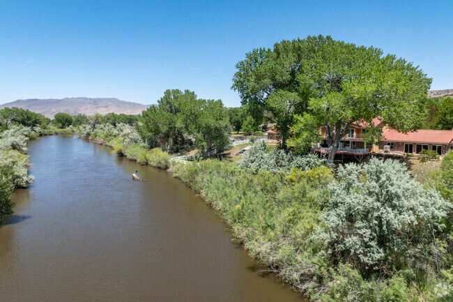 This home on the river is a sprawling ranch-style estate with a southwestern influence and has one of the best lots in town.