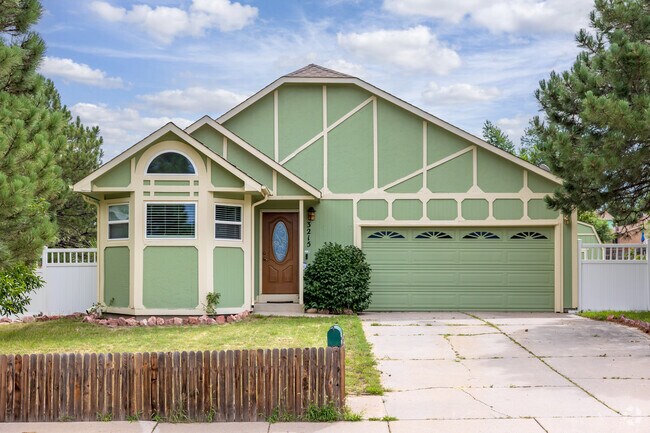 This one-of-a-kind sage green colonial revival home is perfect for the modern family.
