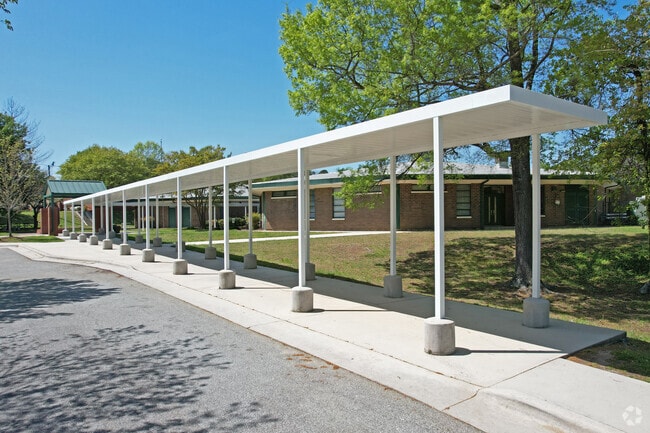A covered walkway greeta Irving Park Elementary School students arriving to campus.