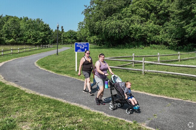Local residents take a family walk on the Home Town Trail at Passwaters Park.