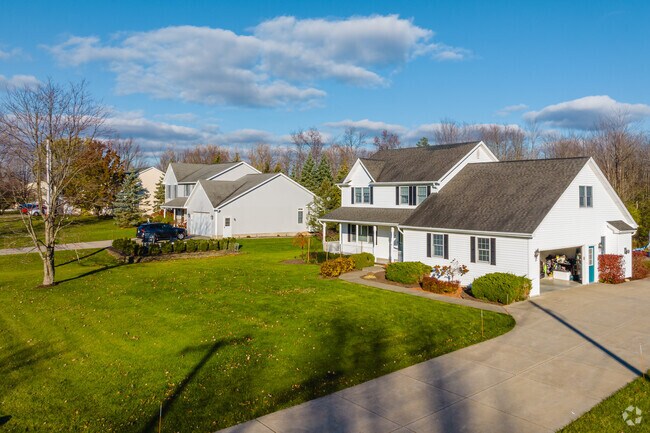 Recently built homes with porches and spacious driveways sit on tidy lawns in Elma.