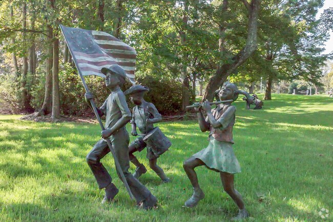 Moulton Park features lifelike statues along its scenic walking paths.