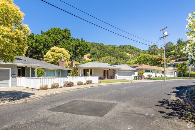 Ranch-style homes line a curving street in Fairfax.