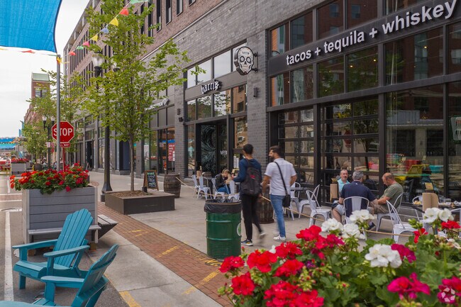 The busy sidewalk seating of local restaurants in downtown East Lansing come alive in spring.
