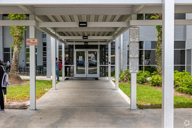 Lorenzo Walker Technical College in Naples welcomes students through the main entrance.