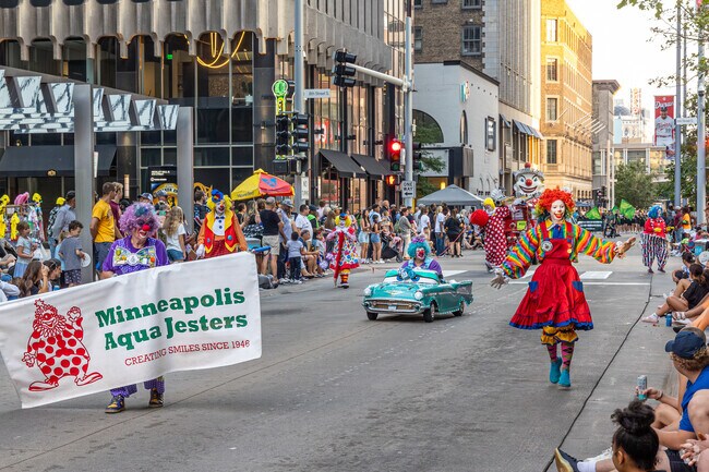 The Minneapolis Aqua Jesters entertained the crowds at the Aquatennial Torchlight Parade.