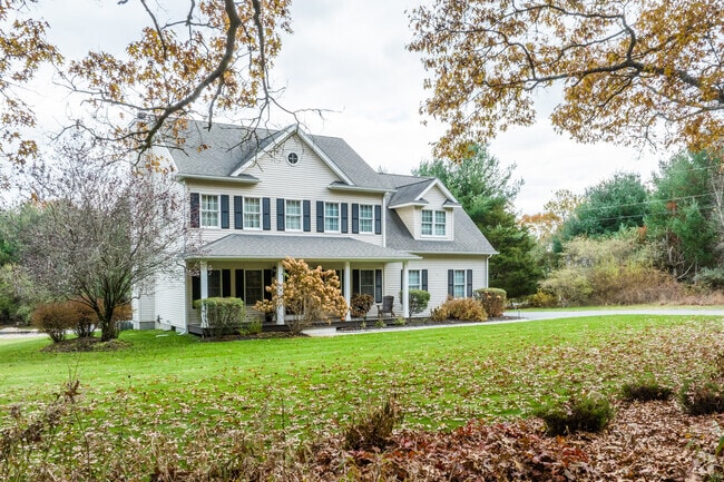 Colonial and Cape Cod homes with porches line quiet streets in Richmond, Rhode Island.