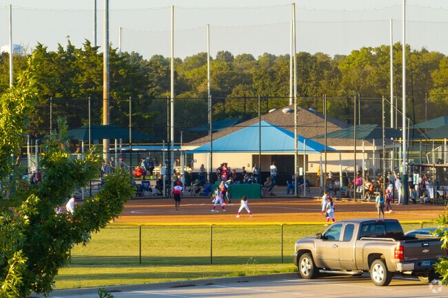 Families gather to watch softball games in Walnut Creek Valley.