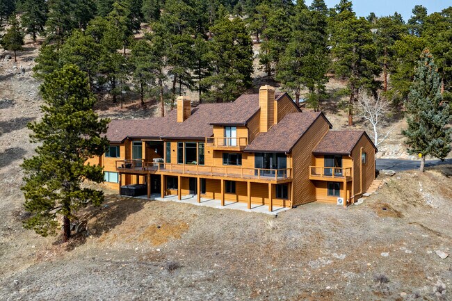 Contemporary mountain homes in Genesee South usual feature big windows and wrap around porches.