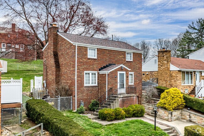 Colonial style homes are popular in the neighborhood of Castle Shannon.