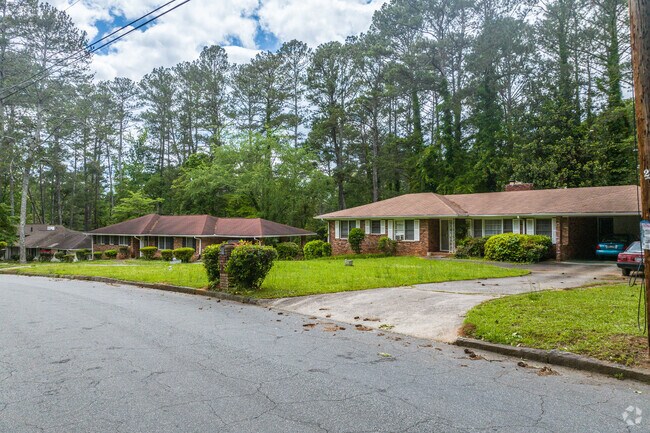 Single-story ranch homes with spacious yards and wooded backdrops reflect the calm, suburban character of West Manor.