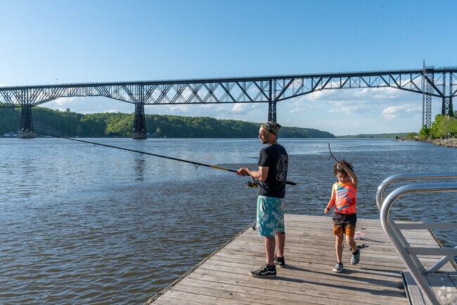 A family enjoys fishing at Victor C. Waryas Park in Downtown Poughkeepsie.