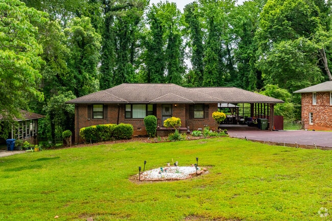 Midcentury brick ranch homes remain a staple in the area, often on large lots with mature trees and plenty of outdoor space.