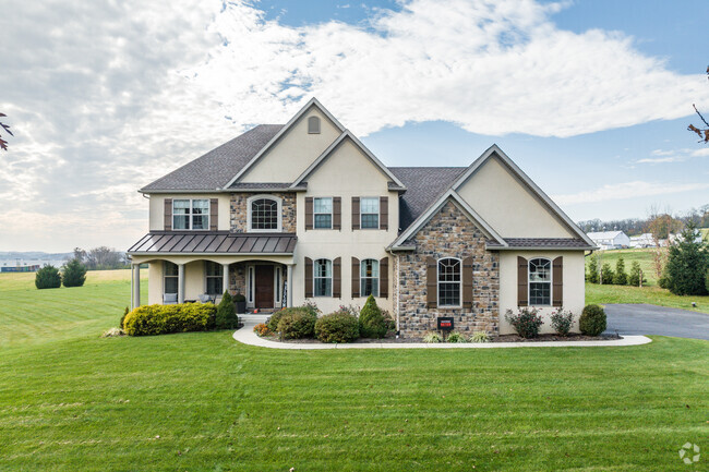 Rustic charm meets modern comfort at this Ontelaunee, PA farmhouse in this a timeless retreat.