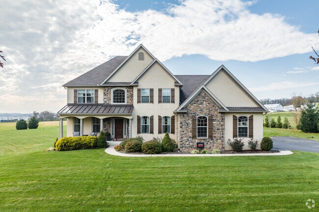 Rustic charm meets modern comfort at this Ontelaunee farmhouse, creating a timeless retreat.