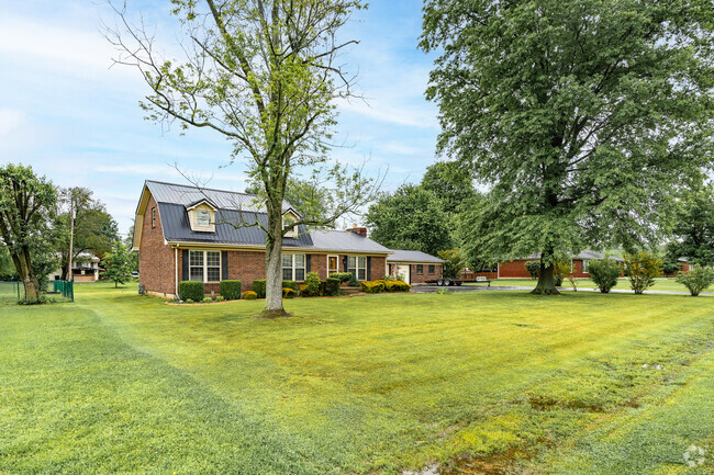 In Brooks, most lots have large front yards and mature trees.