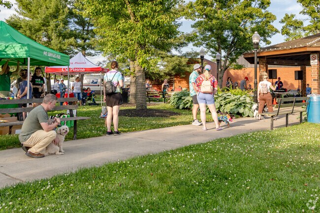 Dogs patiently waiting in line to strut their stuff at the Downtown Dog Parade in Maple Shade, NJ.