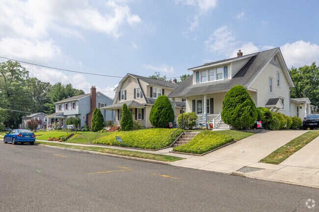 Some of the colonial homes in Delanco sit on raised foundations covered in lush green lawns.