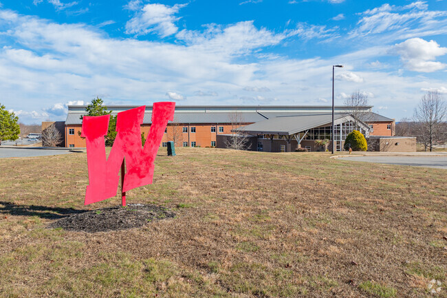 Wheatmore High School sign and school.