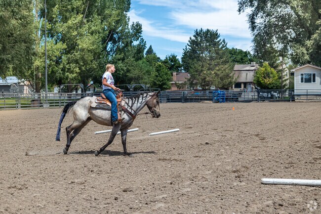 A woman rides a horse at Cache County Fairgrounds in Ellis.