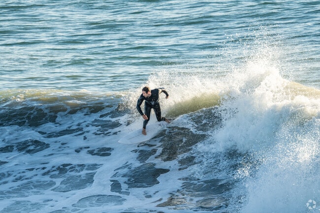 Surfers locally and all over the world come to Huntington Beach to catch its famous waves.