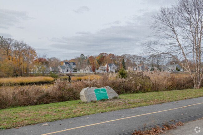 The Acushnet Riverview Park Walkway has a graceful arc to its path through Acushnet.