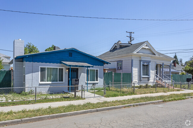 There are many smaller homes in Lowell set close together along sidewalks.