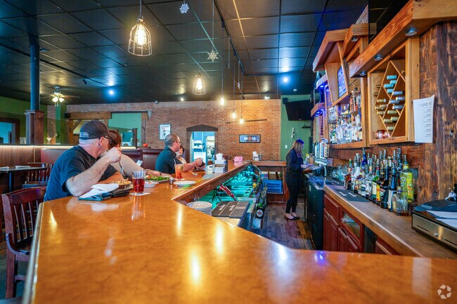 Tavern on the Square serves American food in a charming brick-walled dining area.