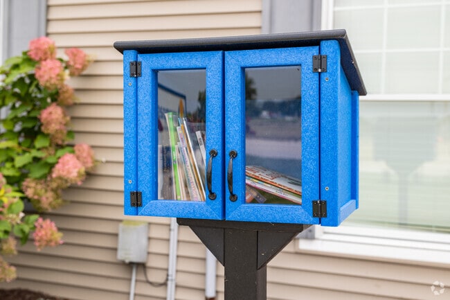 Children at Encompass can find a new book at the little free library on campus.