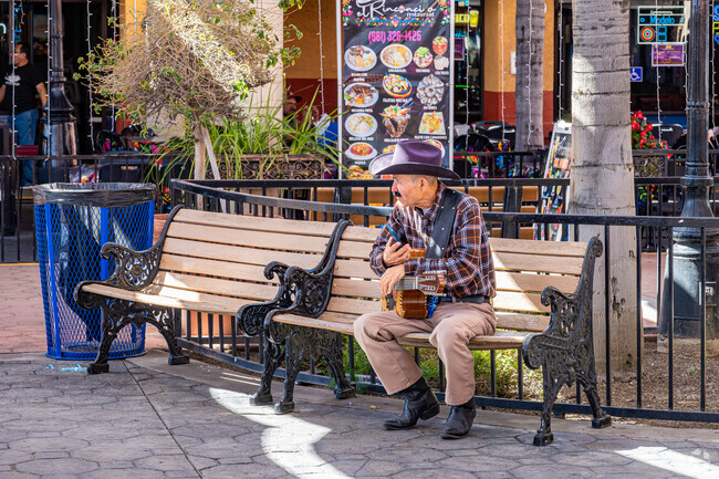 A Lakeview musician takes a break on one of the benches at Plaza Del Pueblo nearby.