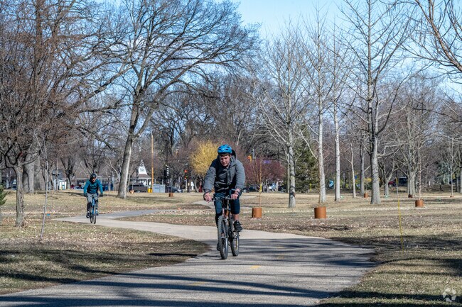 Bikers commute through Northrop on trails along Minnehaha Creek.