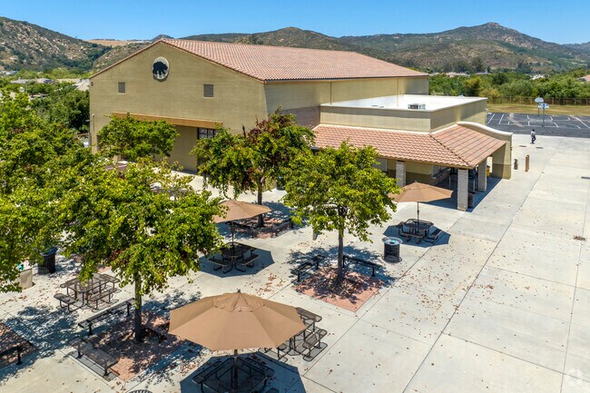The school yard of the Valley High School in East Grove has outdoor seating.