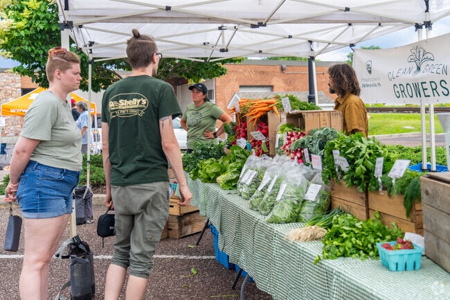 Franconia Township residents head to the Telford Night Market to buy locally grown produce.