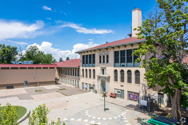 Rear of building featuring playground equipment