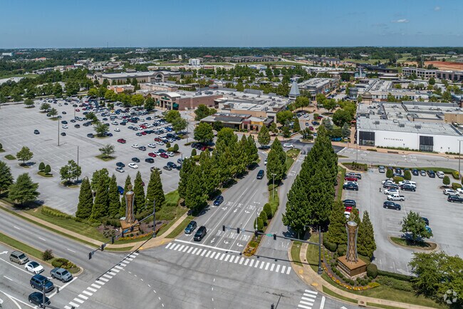 Pinnacle Hills Promenade has chains and small shops just across I-49, near Cave Springs.
