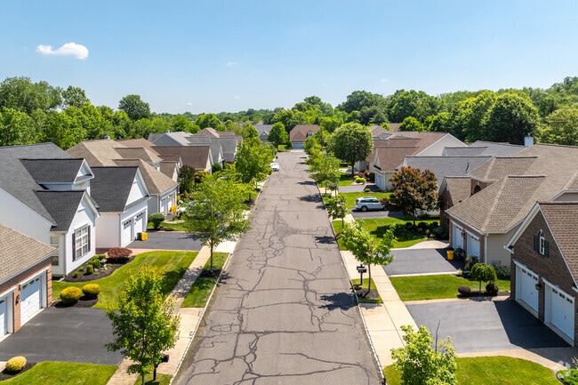 Quiet tree-lined streets are commonplace inside the gated 55+ community of Enchantment in Hamilton Marketplace.