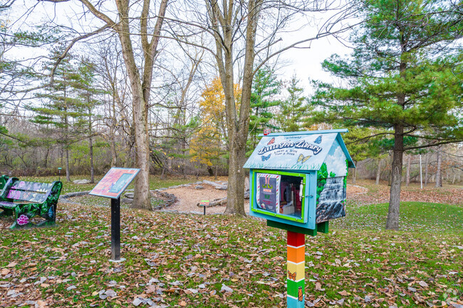 A little free library is colorfully decorated in a neighborhood in Amherst, New York.