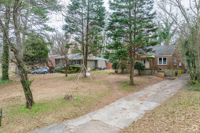 Ranch style homes in Beecher Hills sit back on wooded lots with long side-yard driveways.