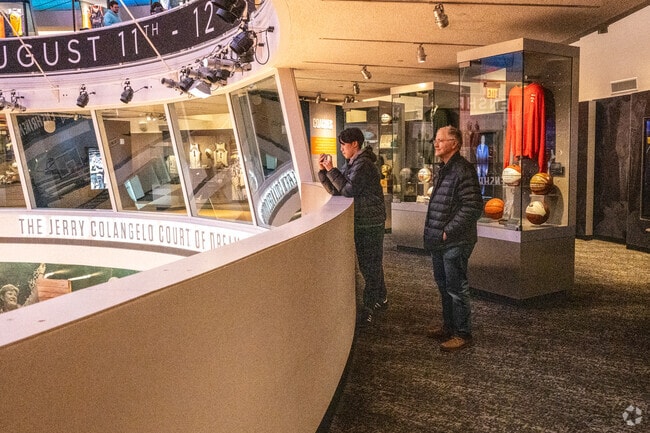 A boy and a man look out at the court in South End.