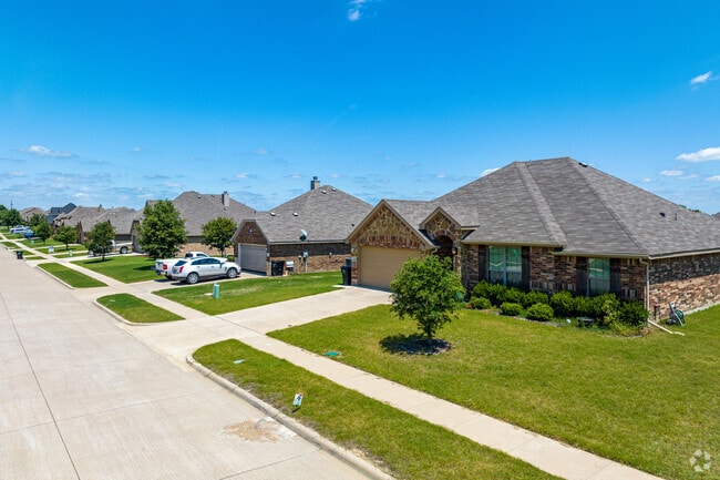Most Crandall homes come with built-in garages and neatly trimmed lawns.