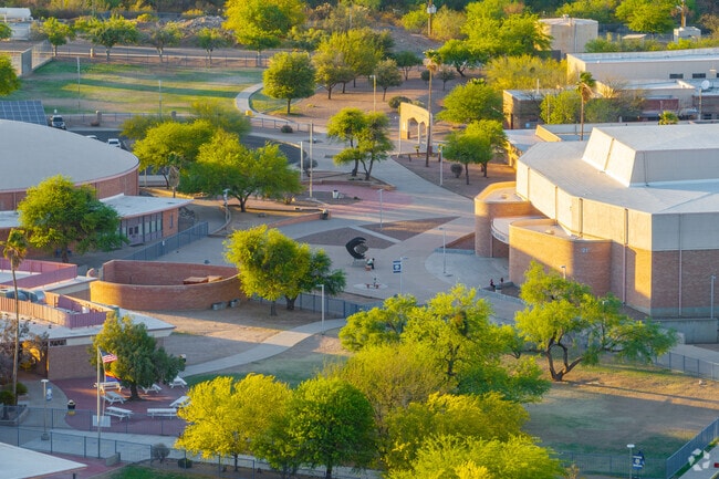 Outdoor gathering areas and building wings spread across the well-landscaped Sahuarita Middle School campus.