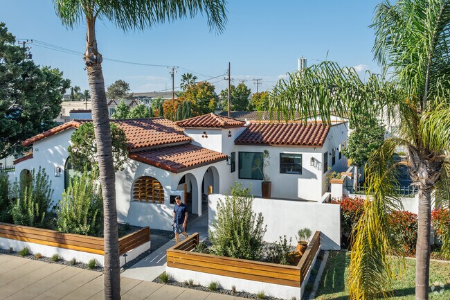 A stylish modern Spanish home sits on a residential street in Recreation Park.