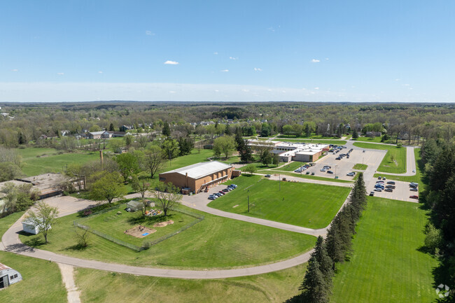 Holly Academy features plenty of green space for sports and a garden center.