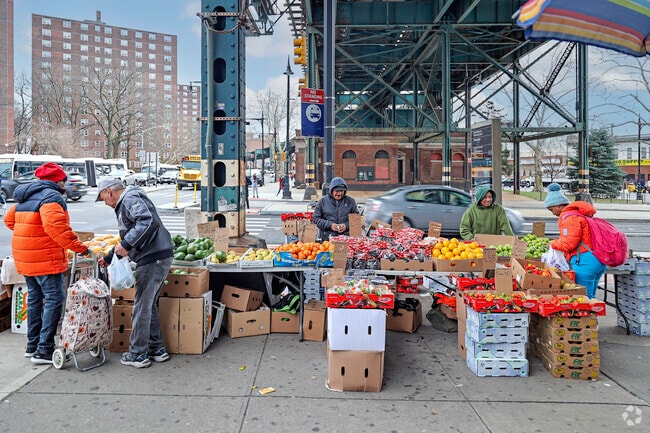 The local fruit stand next to the train station is a neighborhood favorite in Olinville.