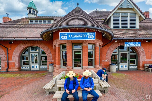 Two gentlement wait on an Amtrak train in the Central Business District of Kalamazoo.