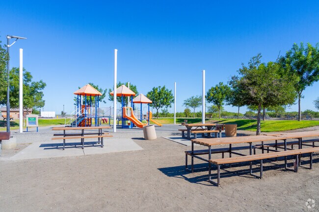 Picnic benches and playground at San Joaquin Sports Park invite family outings.