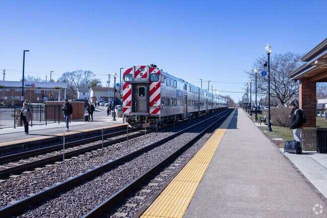 Residents of Cary arrive from on a train at the Cary Metra Station.